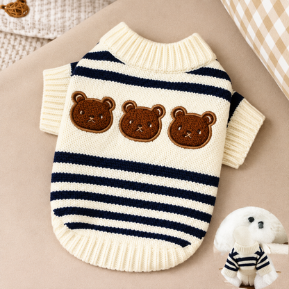 Cream knitted dog jumper with navy stripes and three brown bear faces laid flat