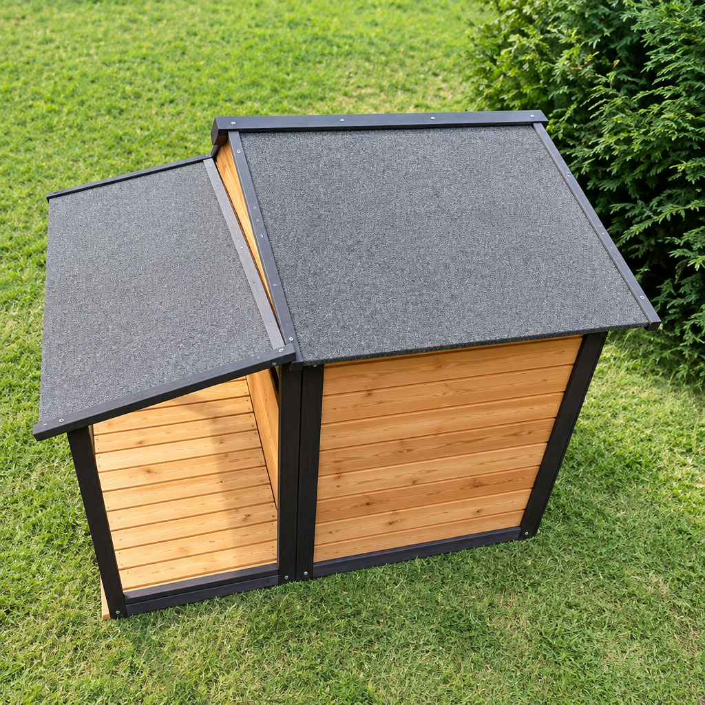 Rear and roof view of a wooden dog kennel with honey-coloured panels and dark grey pitched roof on grass.